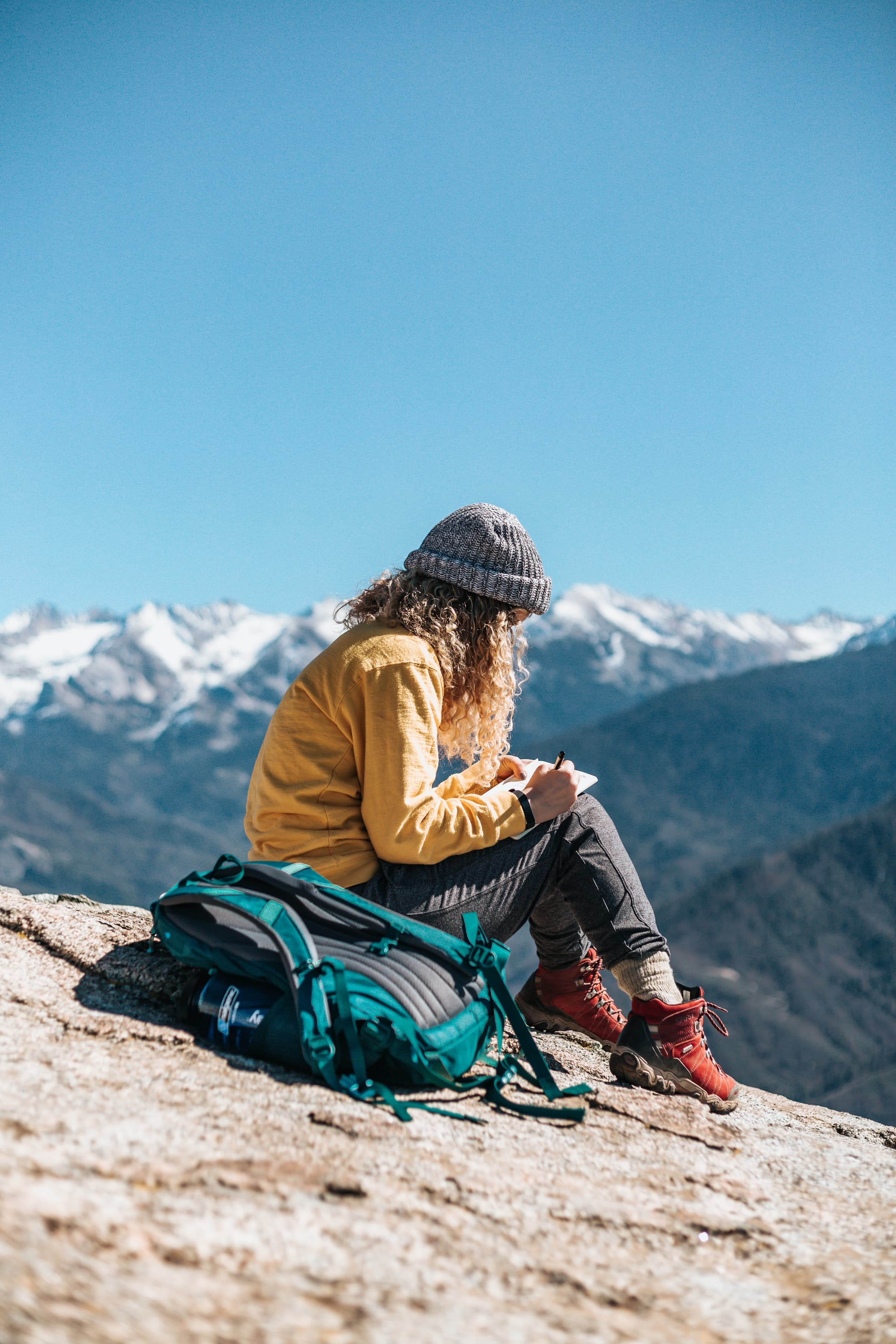 A hiker sitting near the cliff